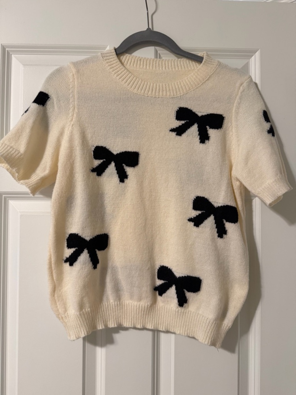 Cream Short-Sleeve Sweater with Black Bow Accents